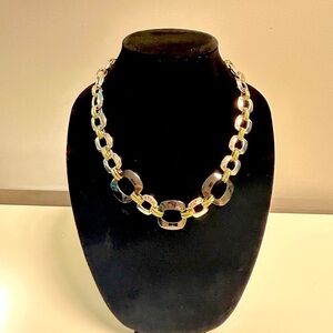 Alfani adjustable necklace with large silver, squares linked with gold accents. 